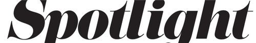 Black elegant script lettering spelling out 'Spotlight' in a decorative font style.