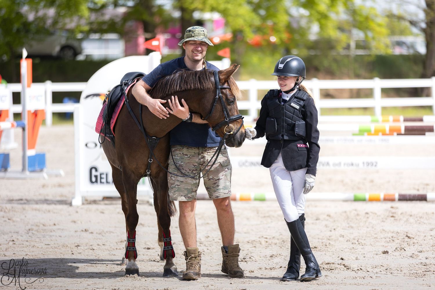 Equestrian rider practices dressage movements with their horse in an outdoor arena during training session.