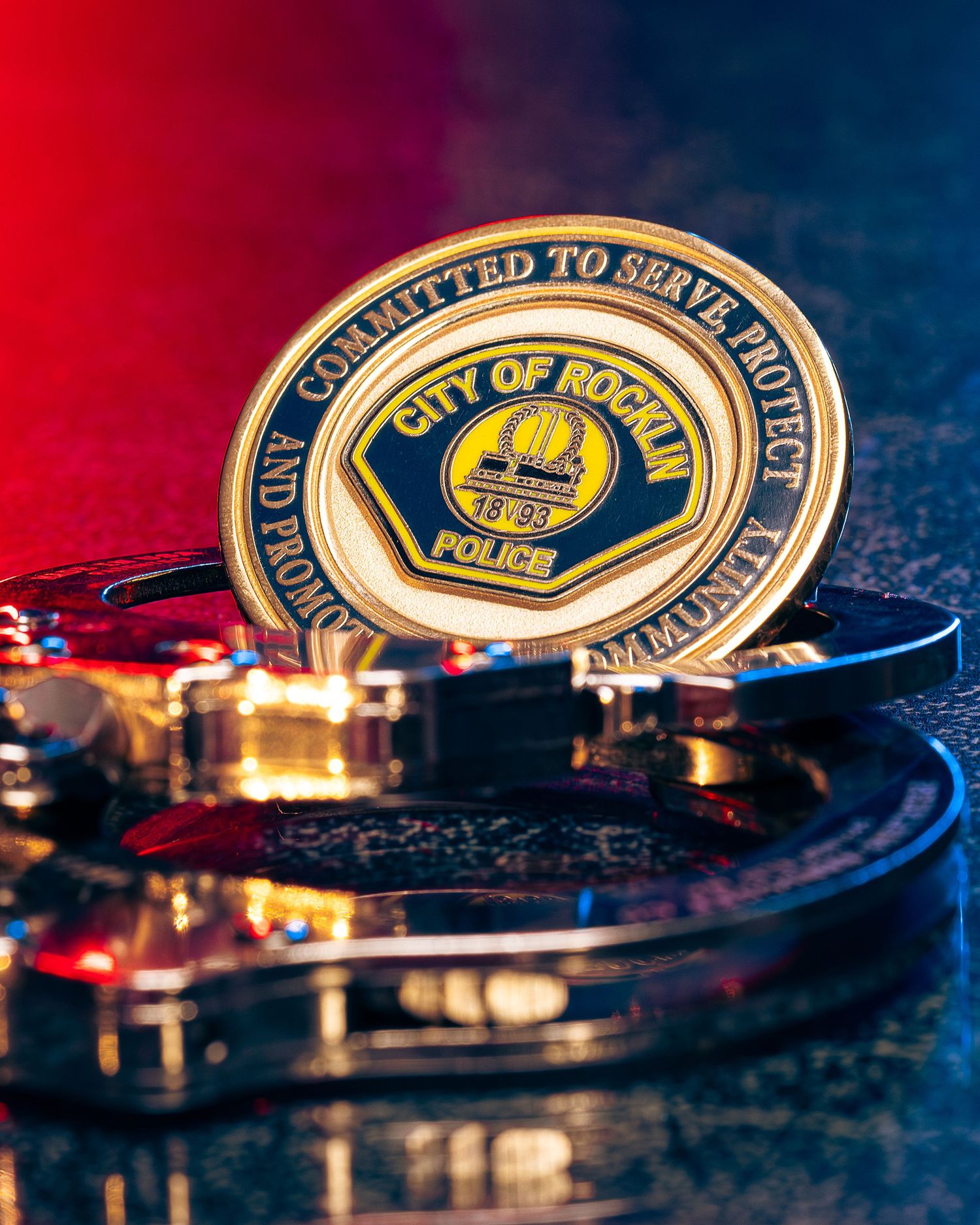 Close-up of police department badges and emblems with dramatic lighting.