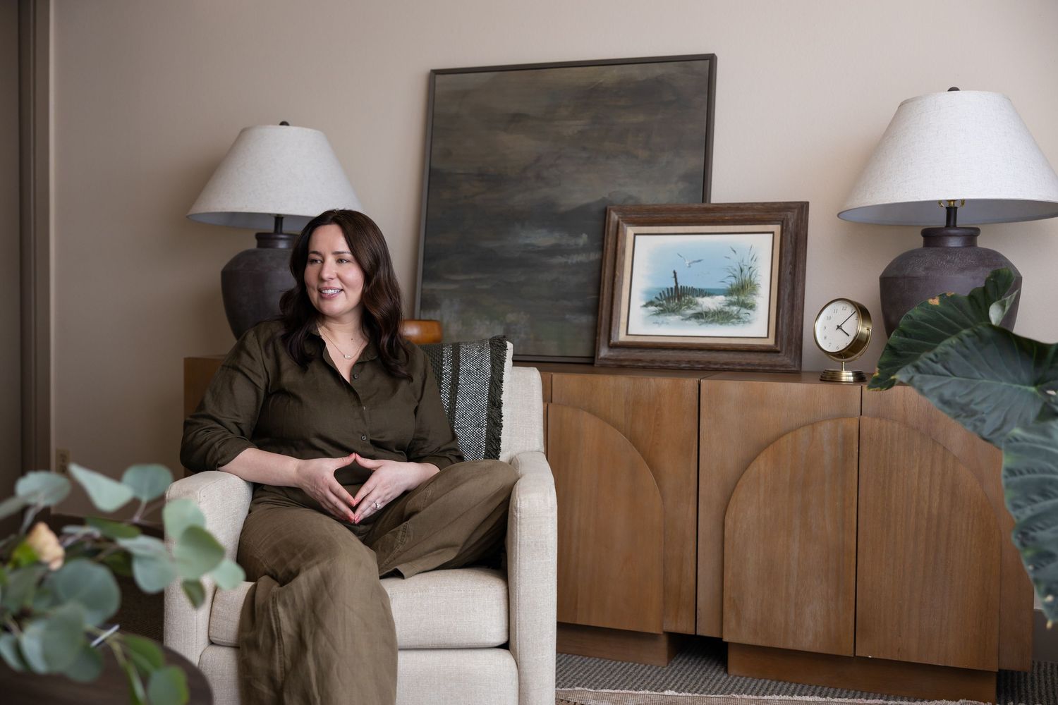 woman mental health therapist sitting in office room chair talking to client in  room for lifestyle marketing branding photo Tacoma, wA
