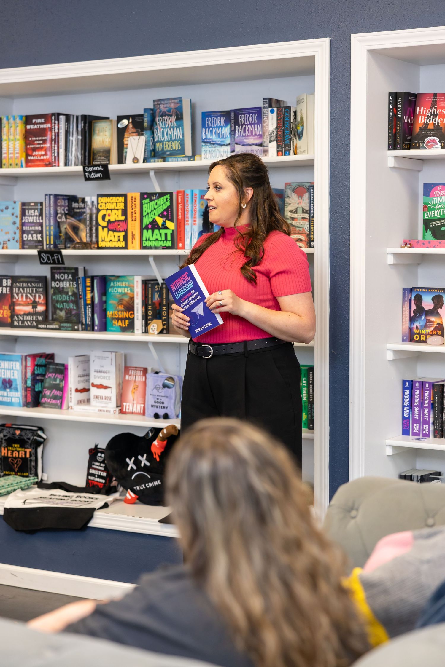 self published indie woman author and coach Melissa Castro book signing event talking about group in front of audience Seattle, WA bookstore