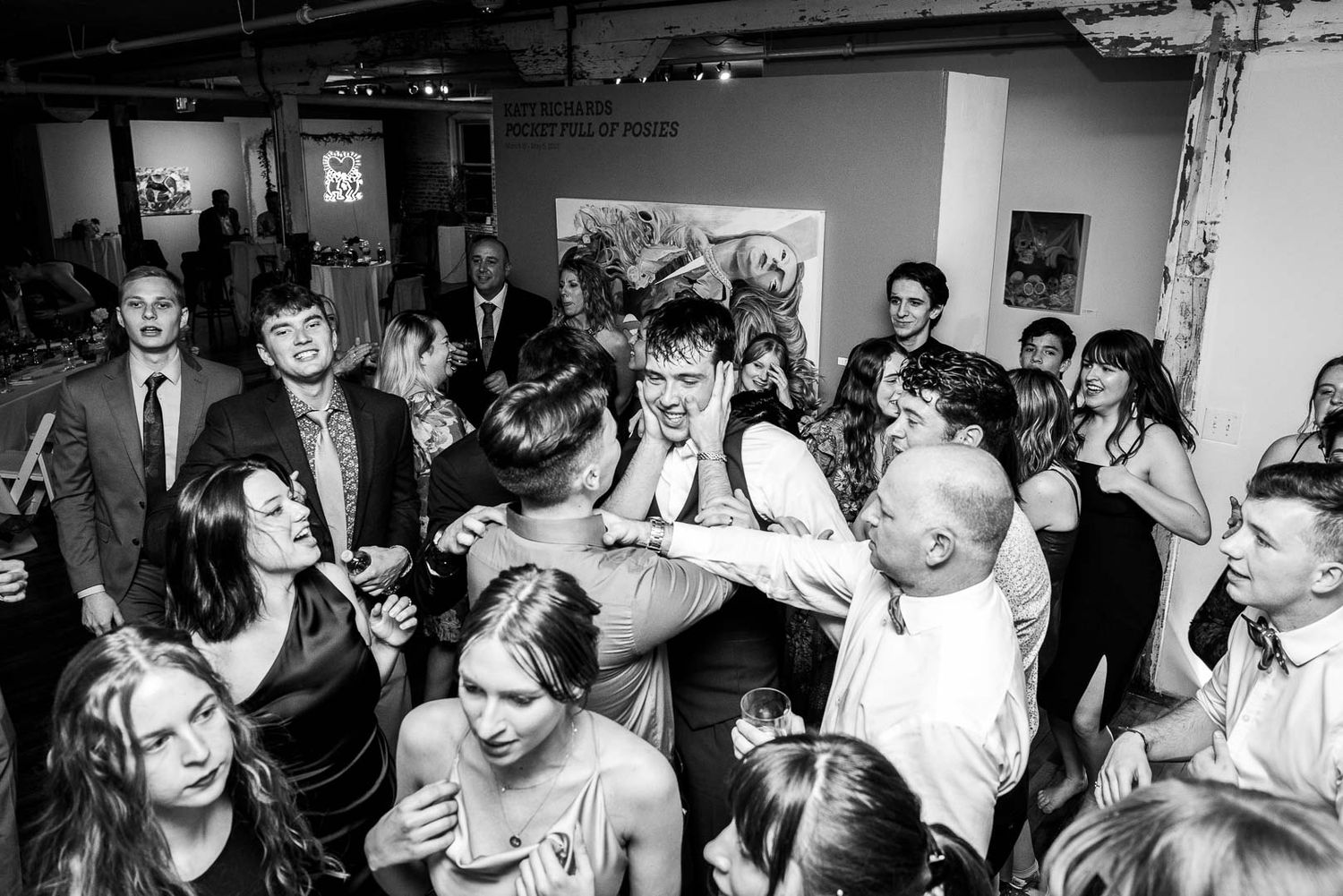 High-energy wedding reception dance floor full of guests and wedding party, captured by Cleveland wedding photographer.