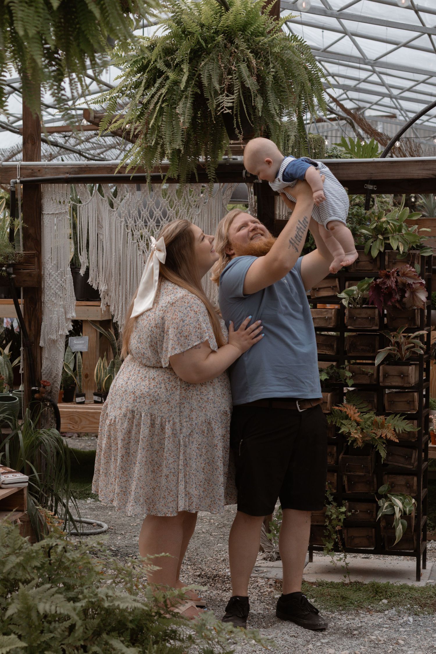 A series of four romantic photos showing a couple embracing in a greenhouse setting with tropical plants and palm trees.