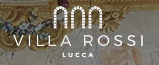 Ornate gold architectural details and signage for Villa Rossi in Lucca with decorative molding and lighting.