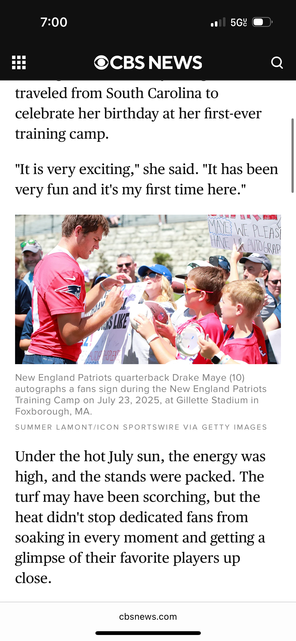 Fans gather at Patriots training camp under sunny skies at Gillette Stadium.