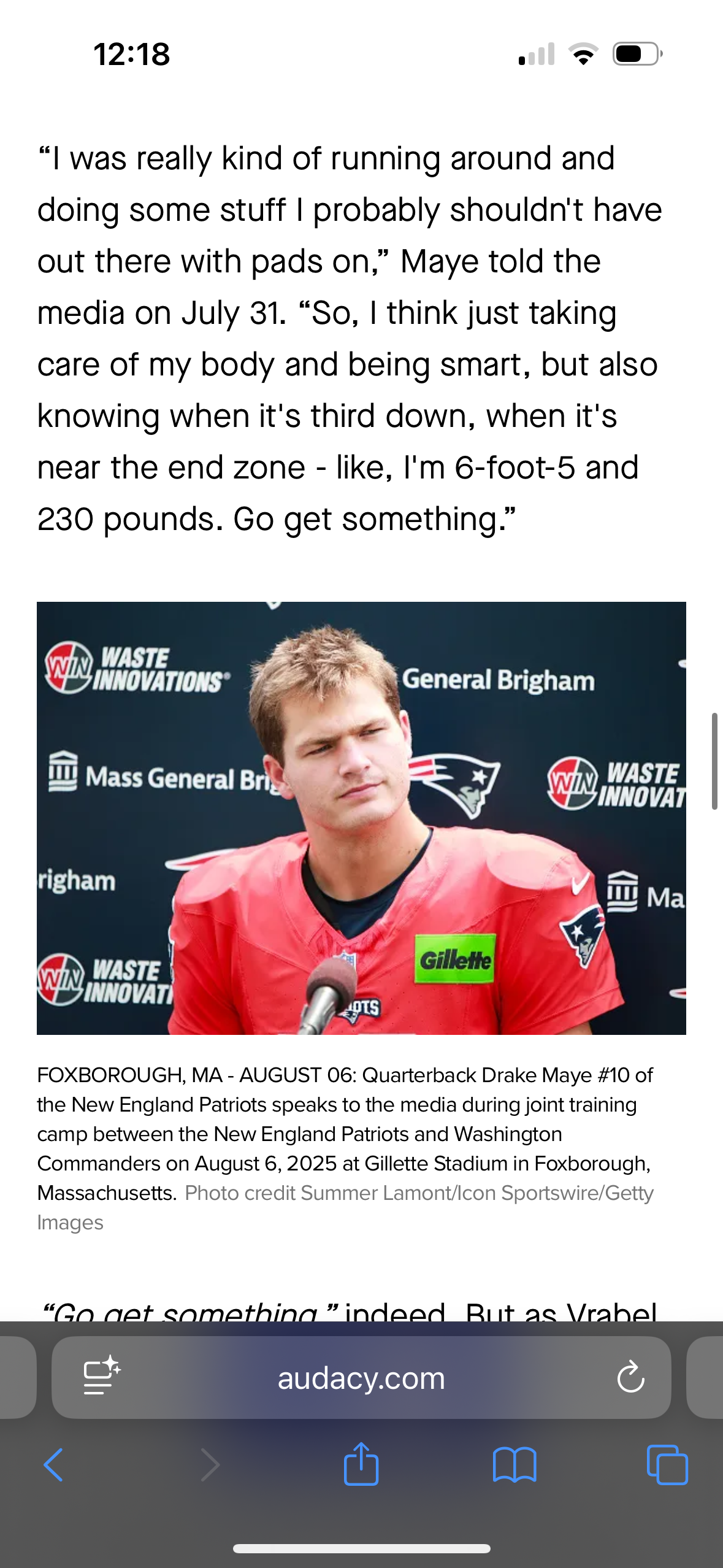 Patriots quarterback participates in training camp practice wearing red practice jersey.