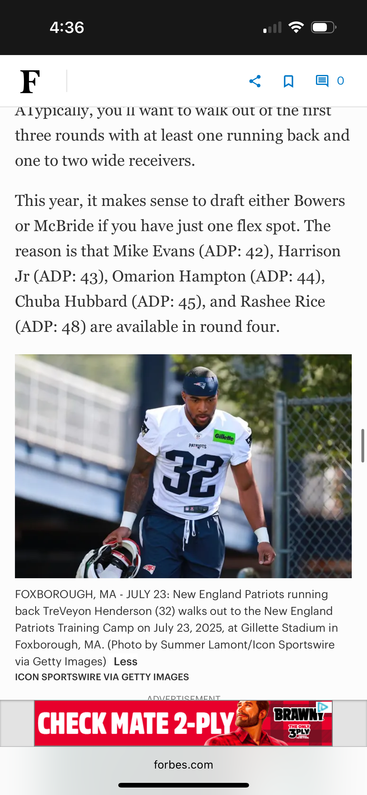 Patriots running back in uniform walks through training camp at Gillette Stadium.