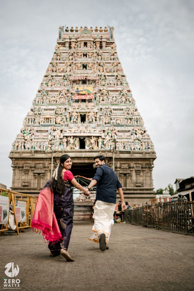 Romantic photo sequence in front of a grand temple gopuram with traditional architecture.