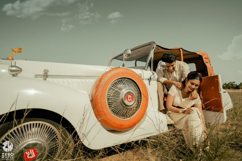 Retro-styled photography series showing orange life preservers and vintage automobiles in a rustic outdoor setting.