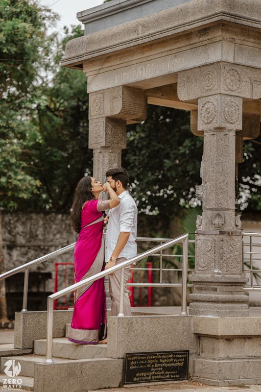 Intimate couple portraits captured at a historic stone temple with ornate carvings and pillars.