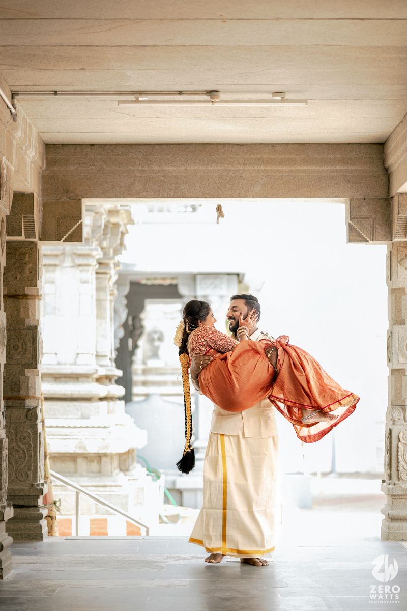 A sequence of traditional dance movements captured in a temple corridor with orange and white attire.