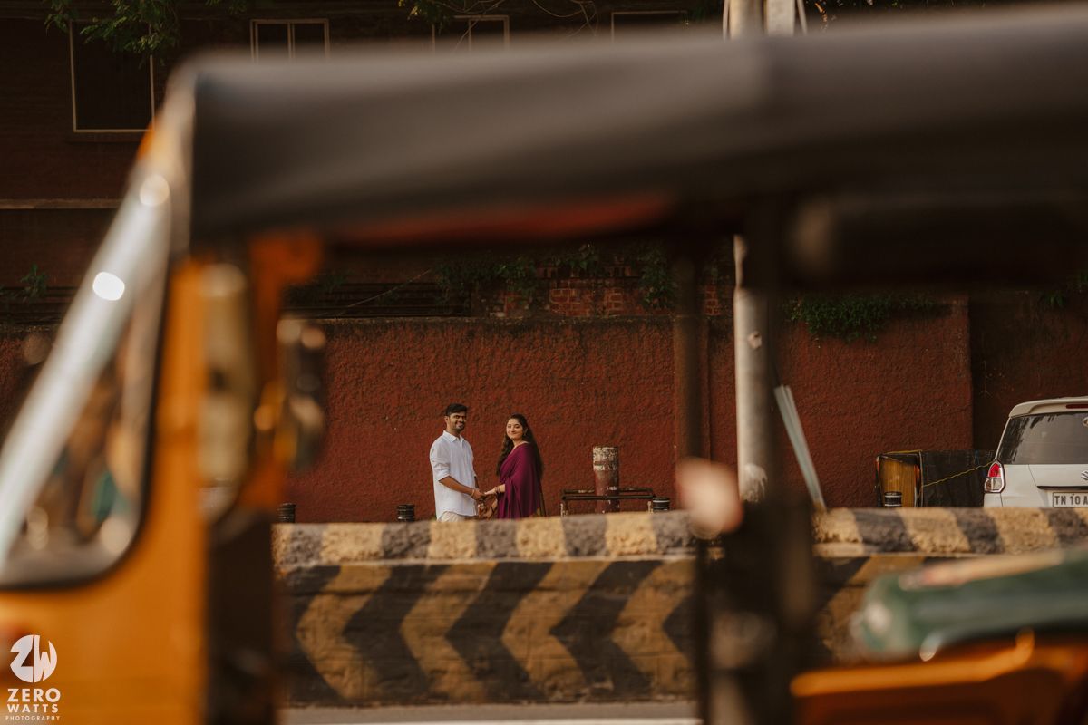 Artistic street photography with warm tones and urban elements in foreground.