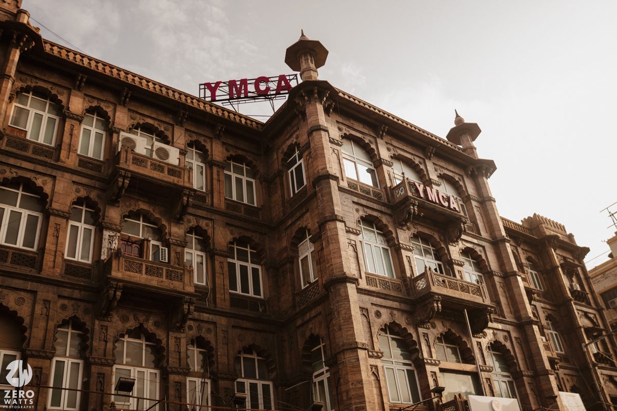Ornate colonial era building facade with Victorian architecture details captured in sepia tones.