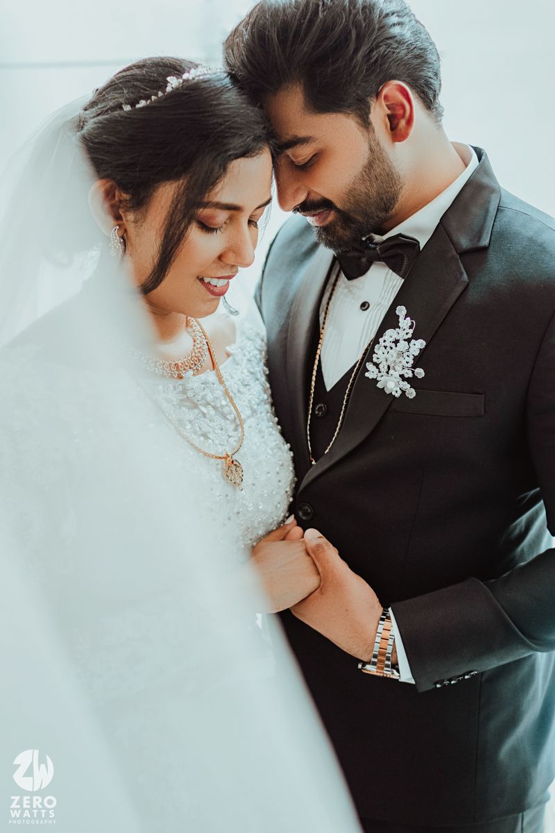 Romantic wedding portraits showing tender moments between newlyweds in elegant attire.