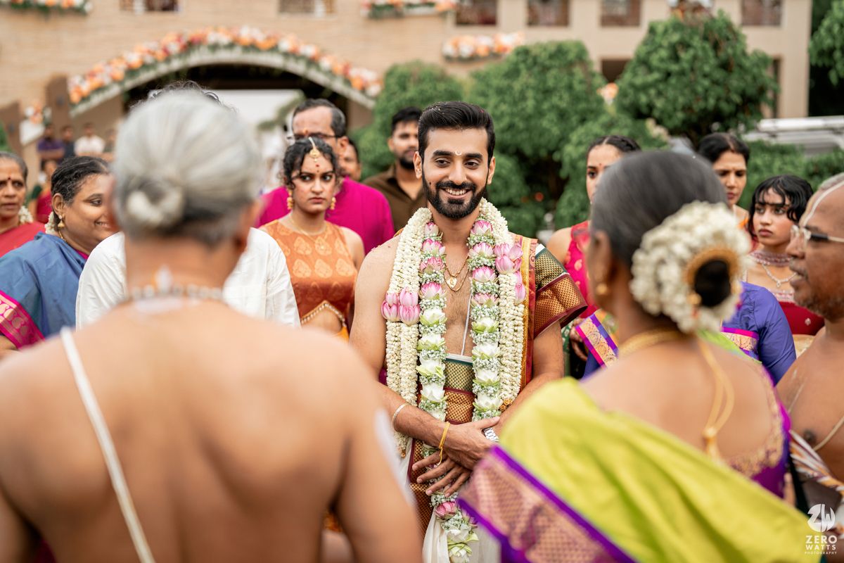 Traditional South Indian wedding celebration with guests gathered outdoors for ceremonial rituals.