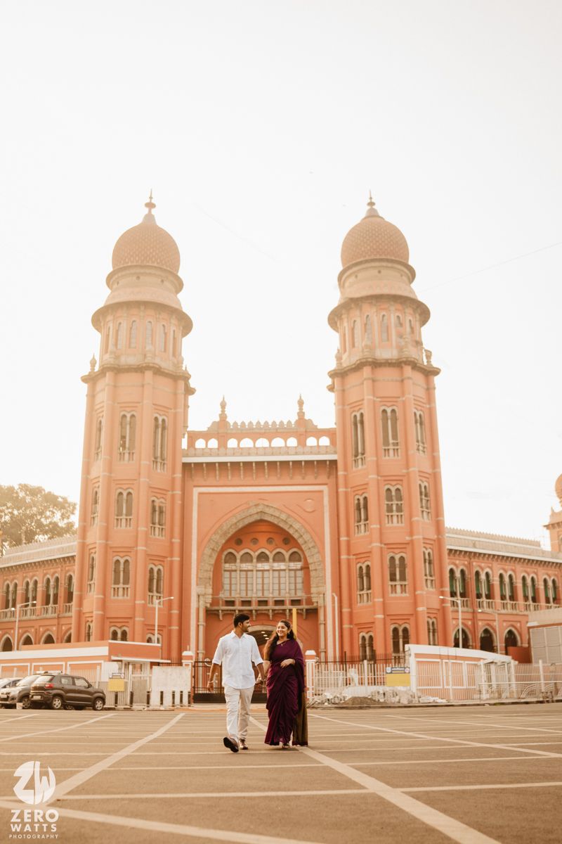 Historic mosque facade with symmetrical domed towers and ornate architectural details.