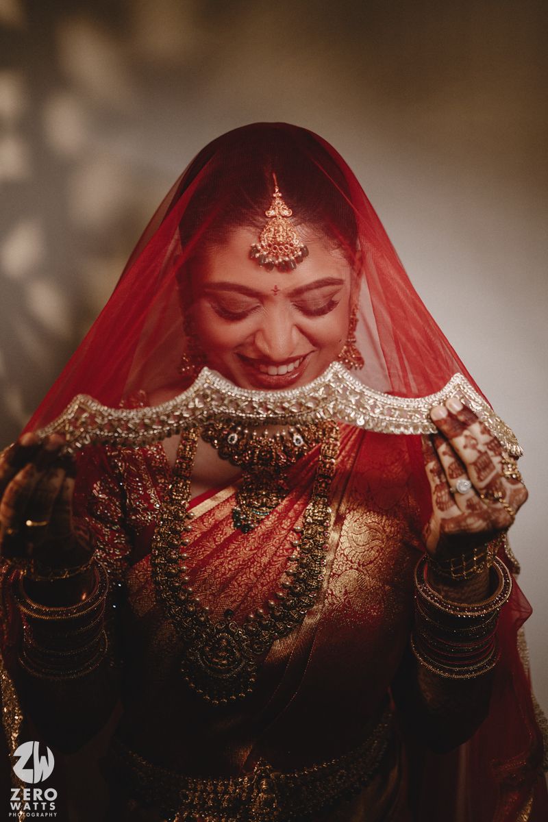 A sequence of photos showing a bride in traditional Indian attire with a red veil and ornate gold jewelry.