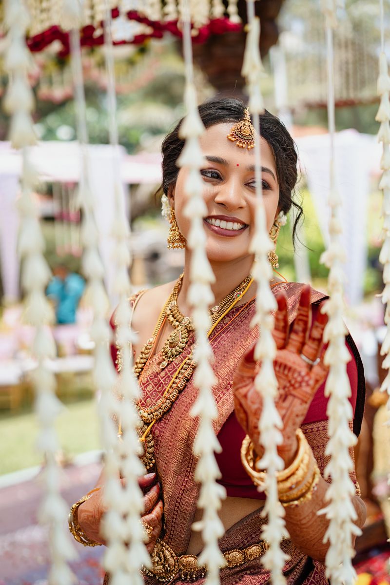 Festive wedding scene with hanging crystal strings and decorative elements creating a romantic atmosphere.