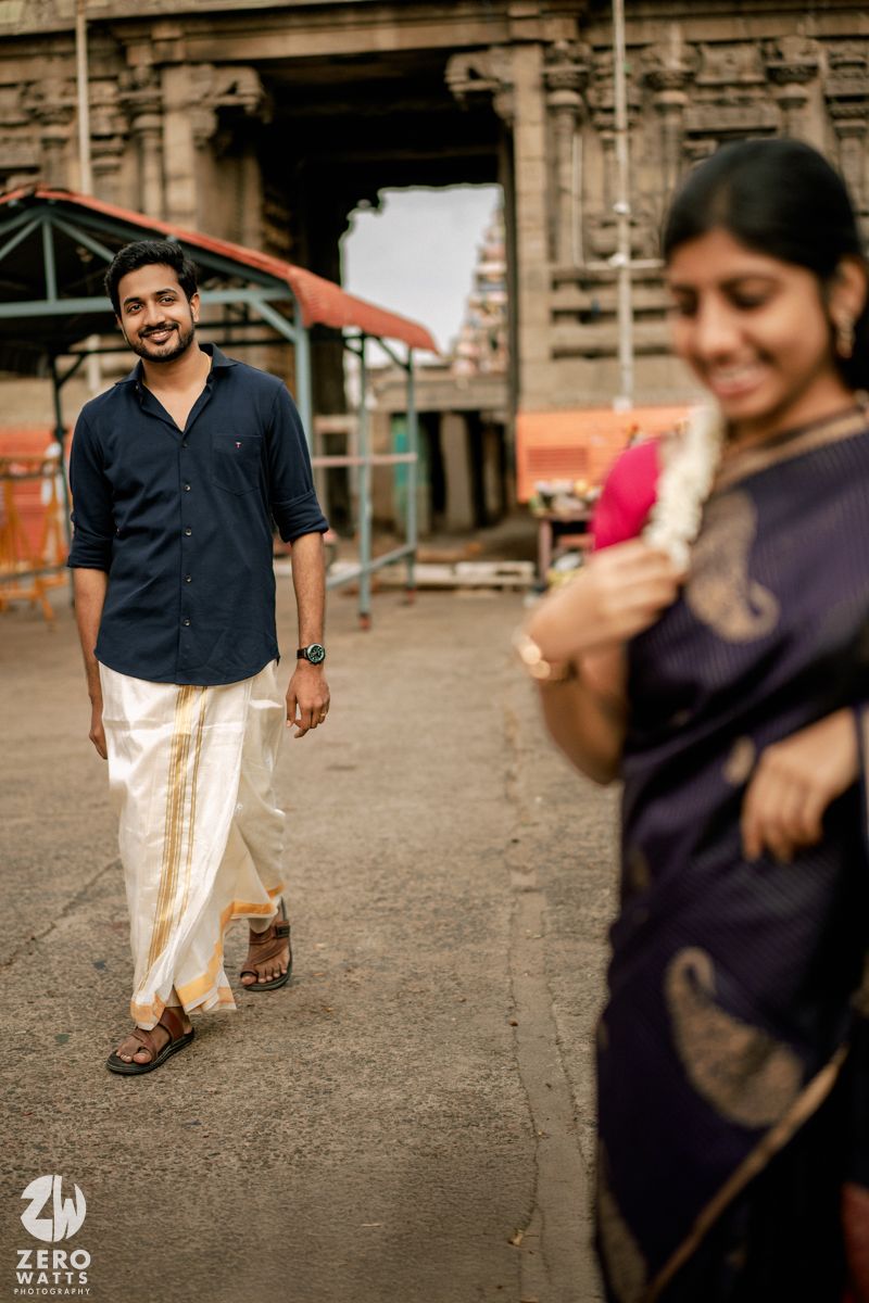 Candid sequence showing a couple's playful interaction outside a traditional temple structure.
