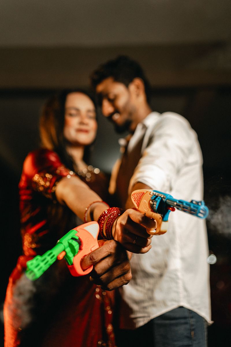 Close-up shots of hands with henna designs and bangles in warm lighting creating an artistic composition.