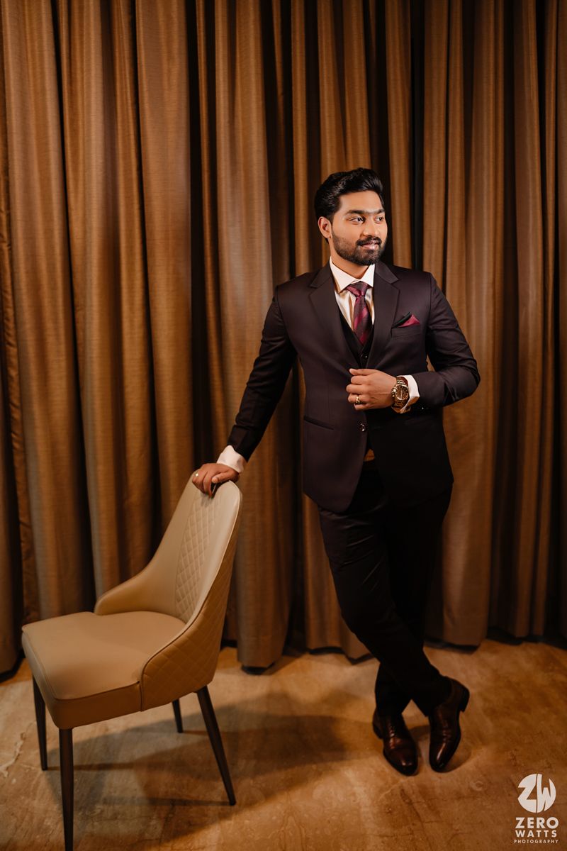 A series of portraits showing someone in a dark suit posing with chairs against brown curtains.
