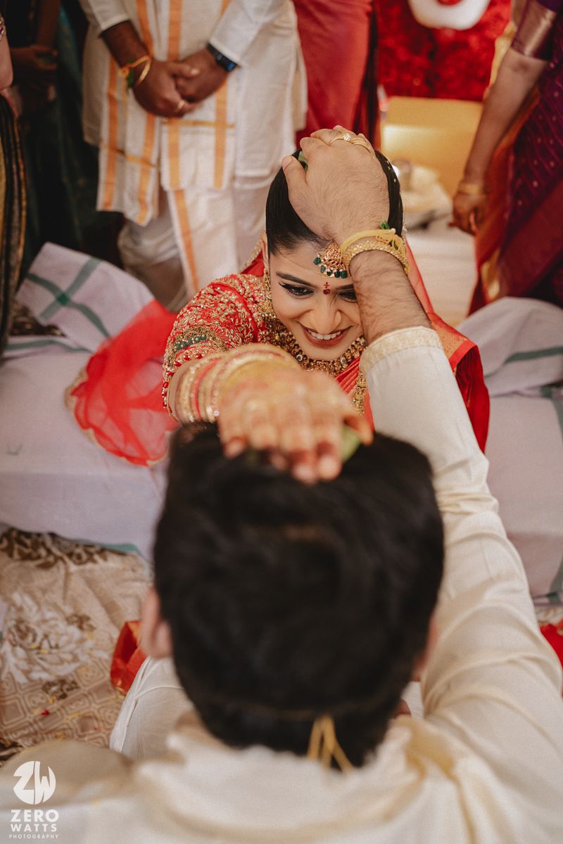 Collage of traditional Indian wedding ceremony moments showing hands and rituals in red and white tones.
