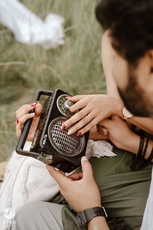 Hands holding and adjusting settings on a vintage camera lens in a series of close-up shots.