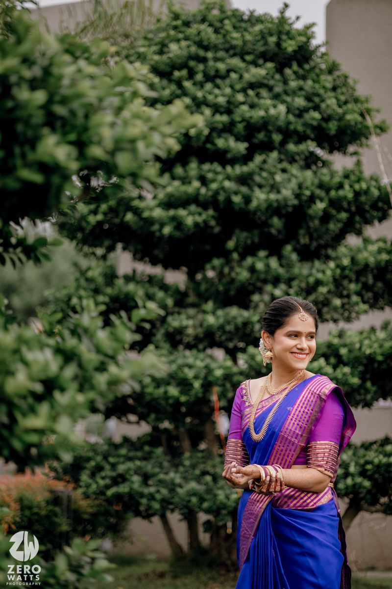 A couple in traditional South Indian attire poses outdoors against lush greenery in a series of candid shots.