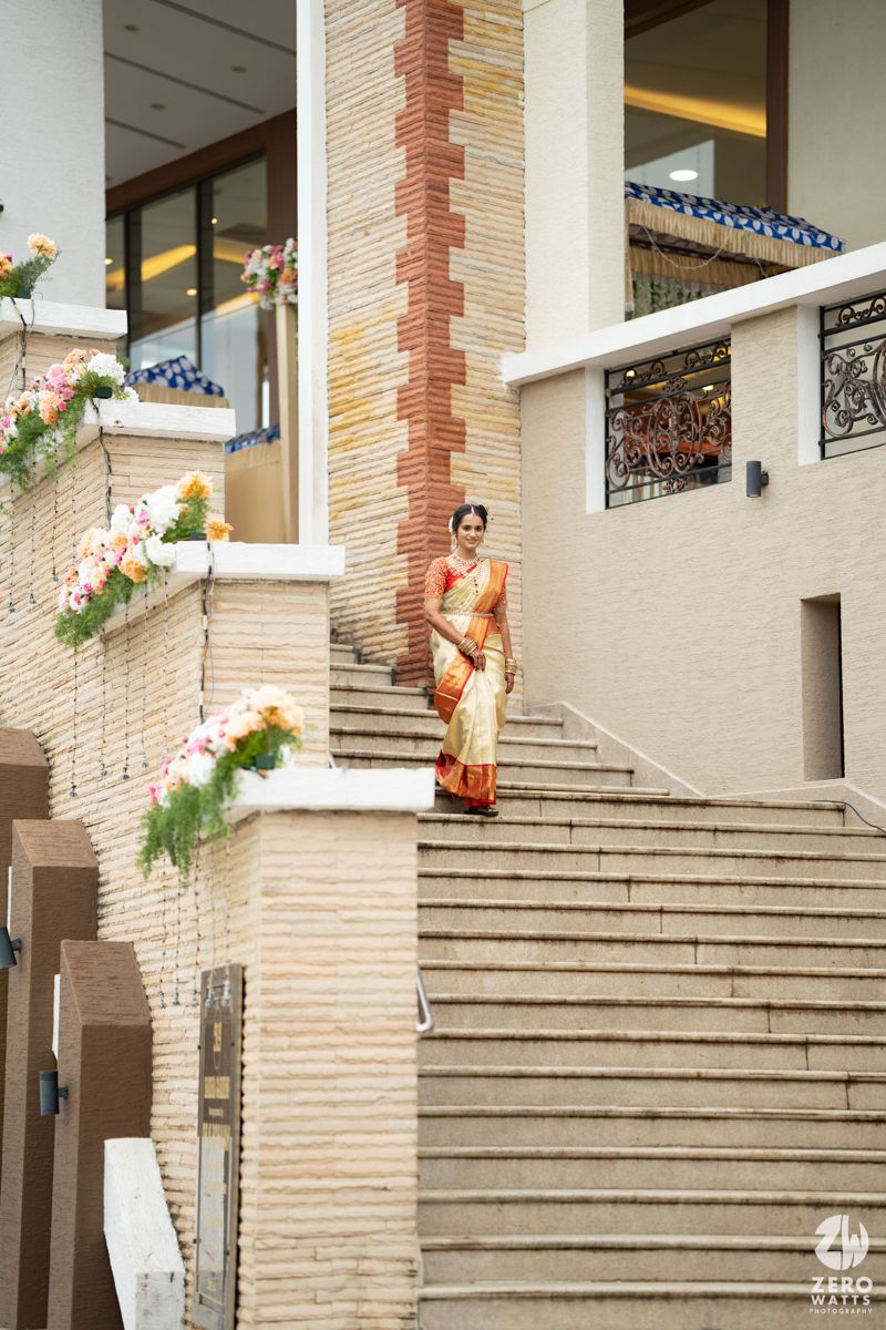 Elegant stone staircase entrance with brick and stone architectural details at a wedding venue.