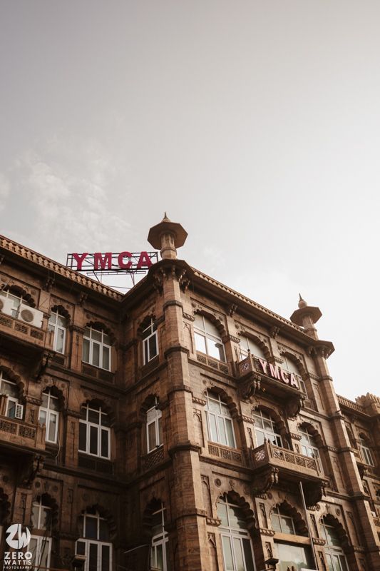 Historic colonial building with ornate architecture and 'Newscat' signage visible on the rooftop.