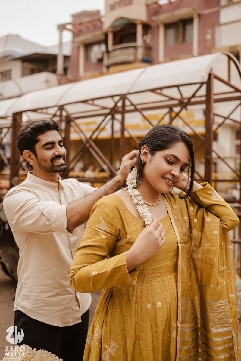 Candid photoshoot sequence showing playful interactions between people in yellow and white outfits.