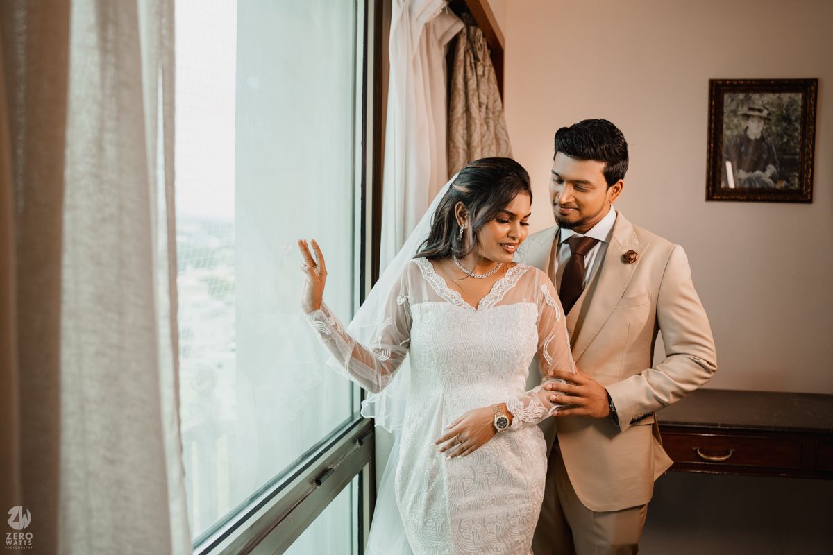 Intimate wedding portrait showing tender moments between newlyweds in beige and white attire.