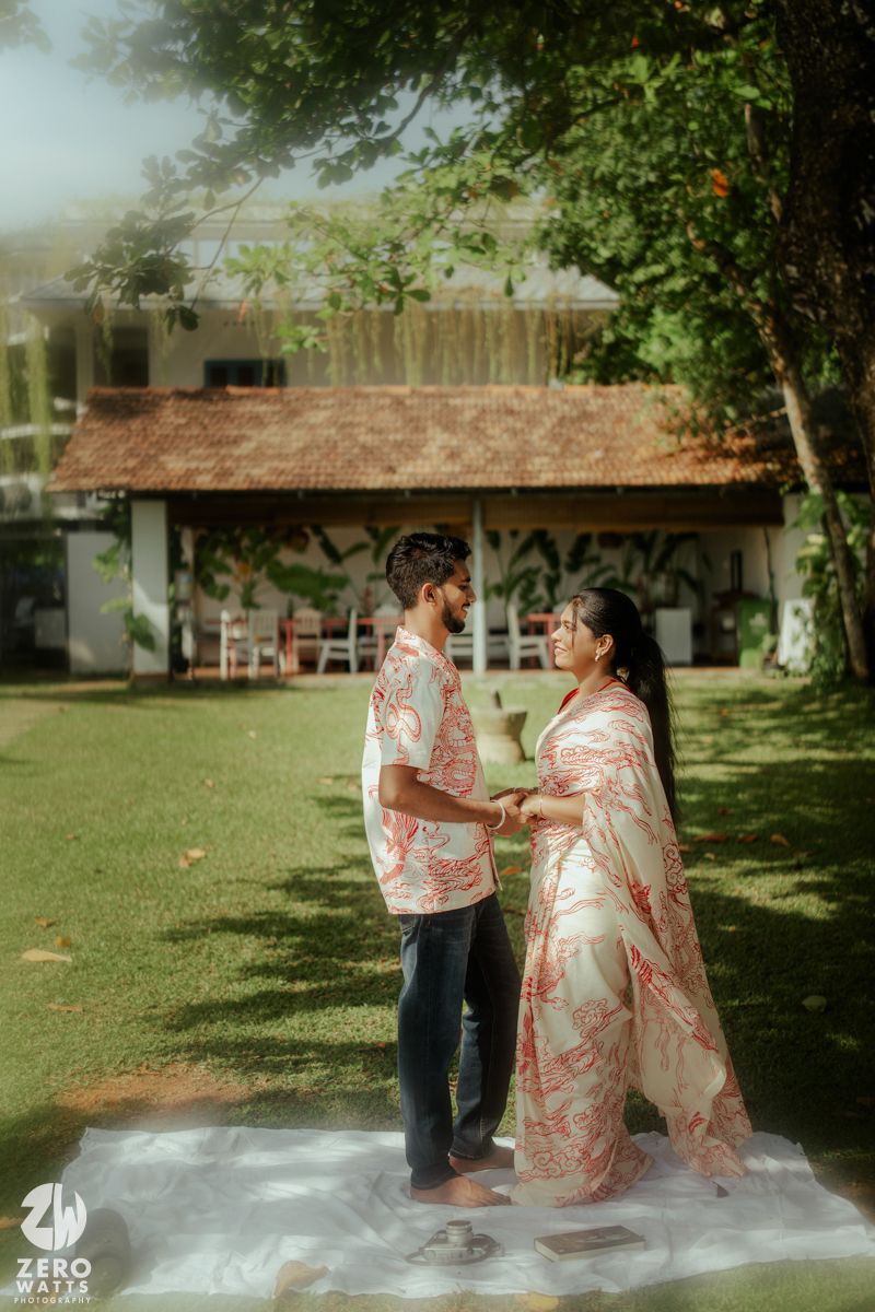 Romantic outdoor photoshoot sequence showing couple in matching red and white attire on garden lawn.