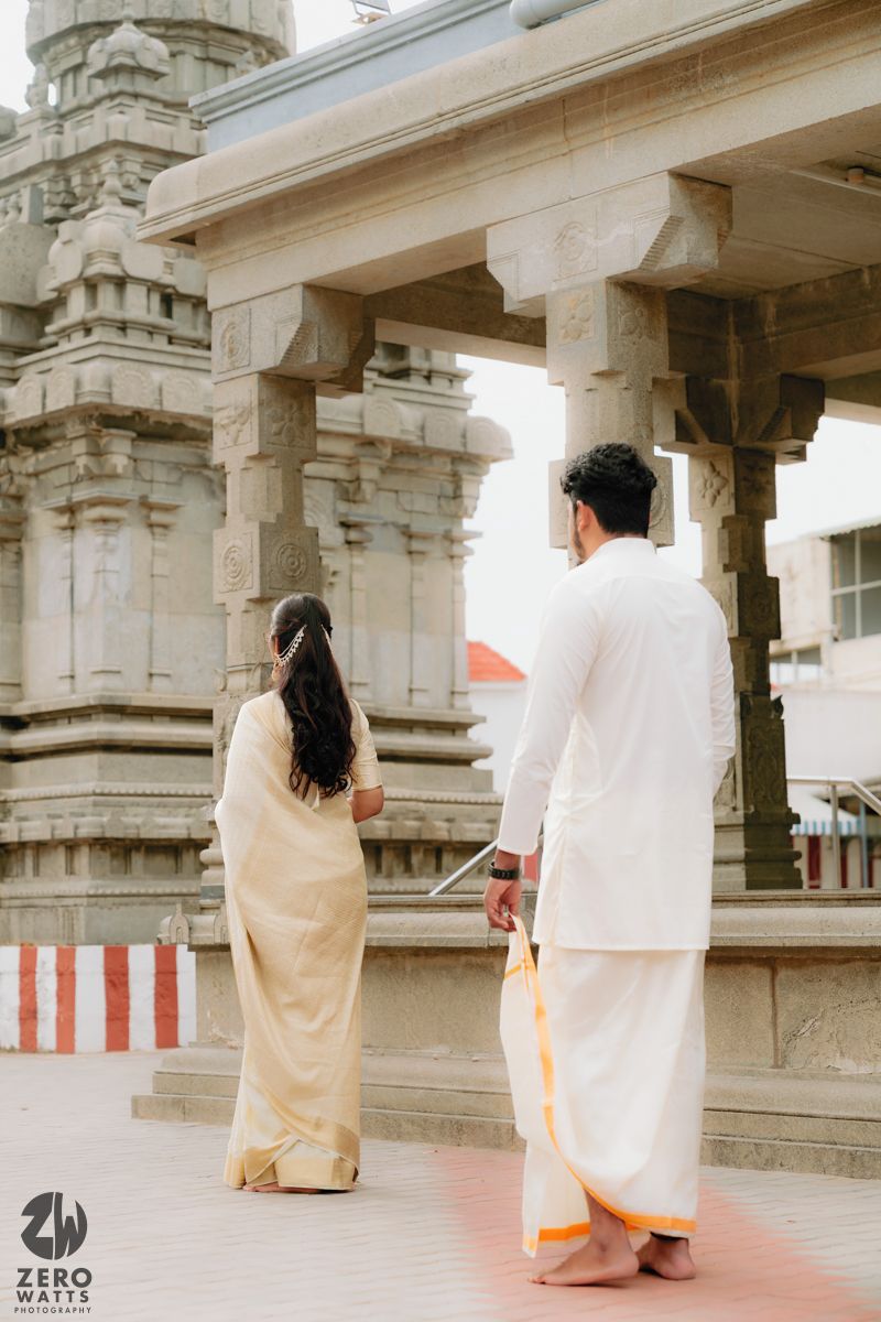 A series of romantic photos showing a couple in traditional Indian attire walking through a temple corridor.
