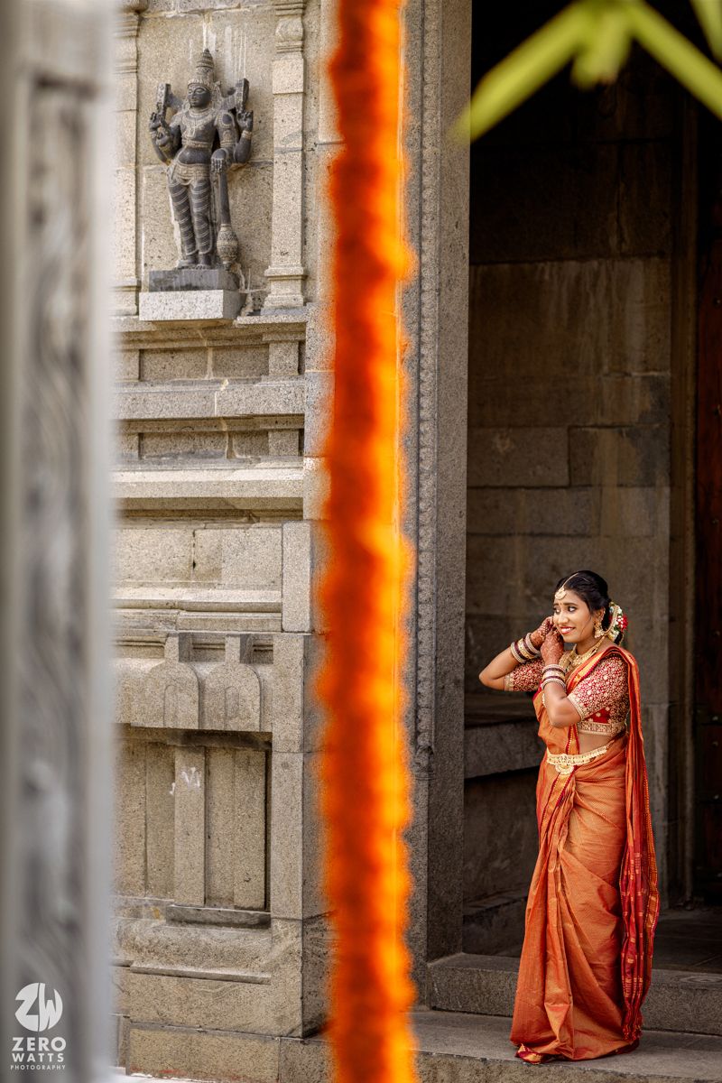 Traditional Indian wedding photography sequence showing bride in orange sari posing elegantly against stone architecture.