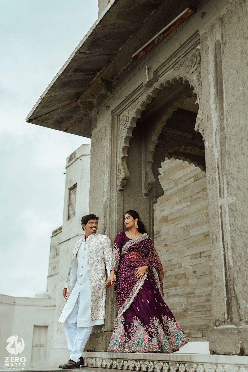 Wedding photography session at a historic stone palace with intricate architectural details.