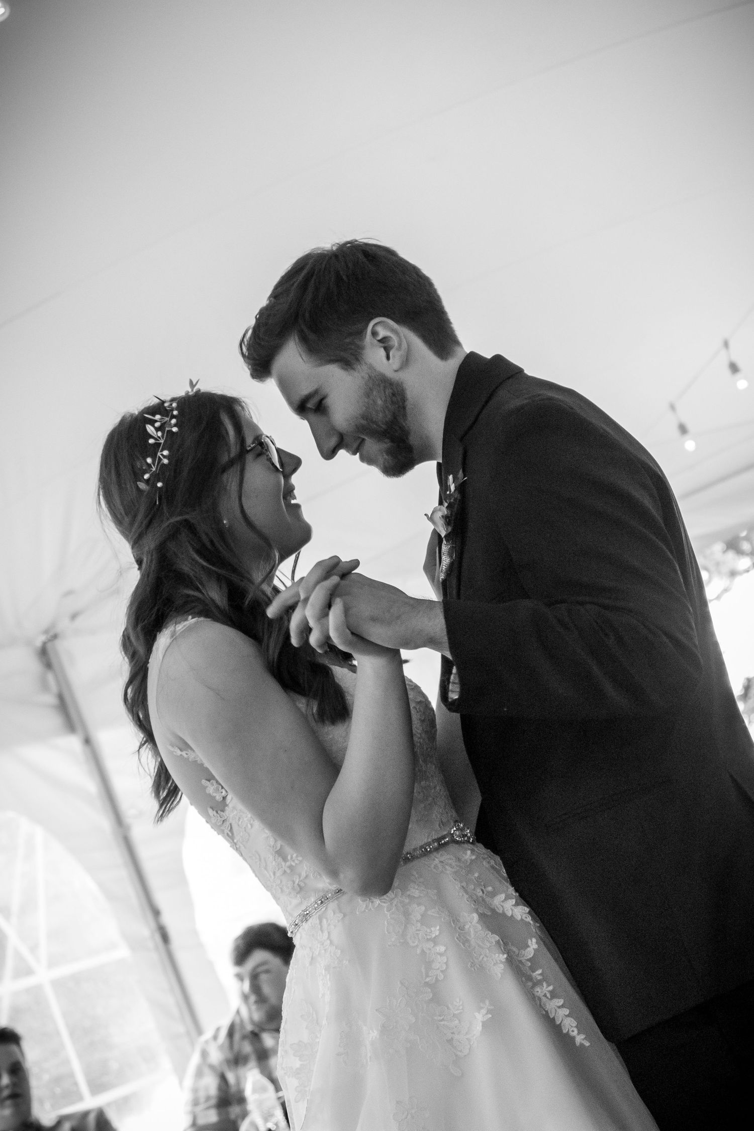 Black and white photo of newlyweds sharing their first dance.
