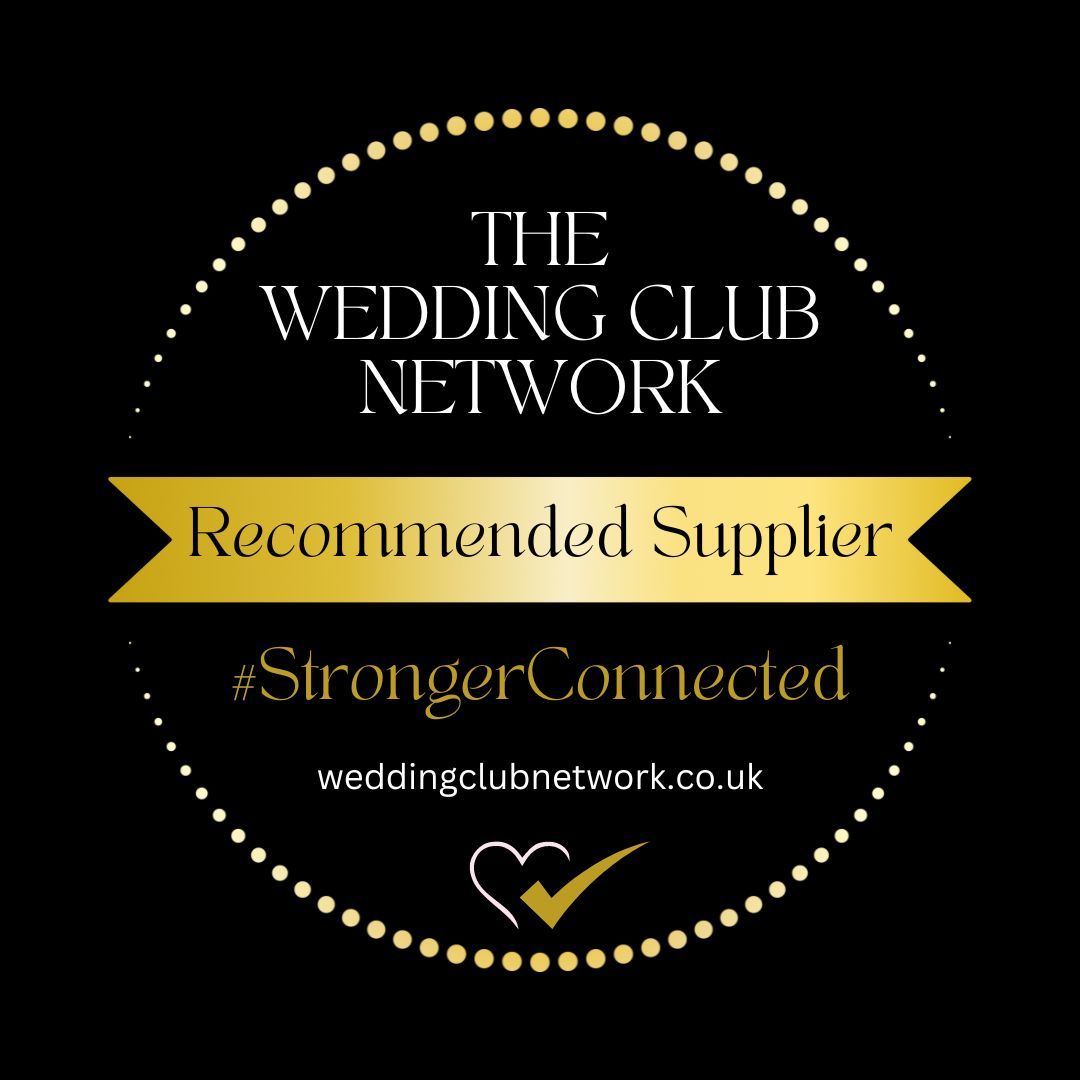 Black circular badge with gold accents for The Wedding Club Network featuring Recommended Supplier status and hearts logo.