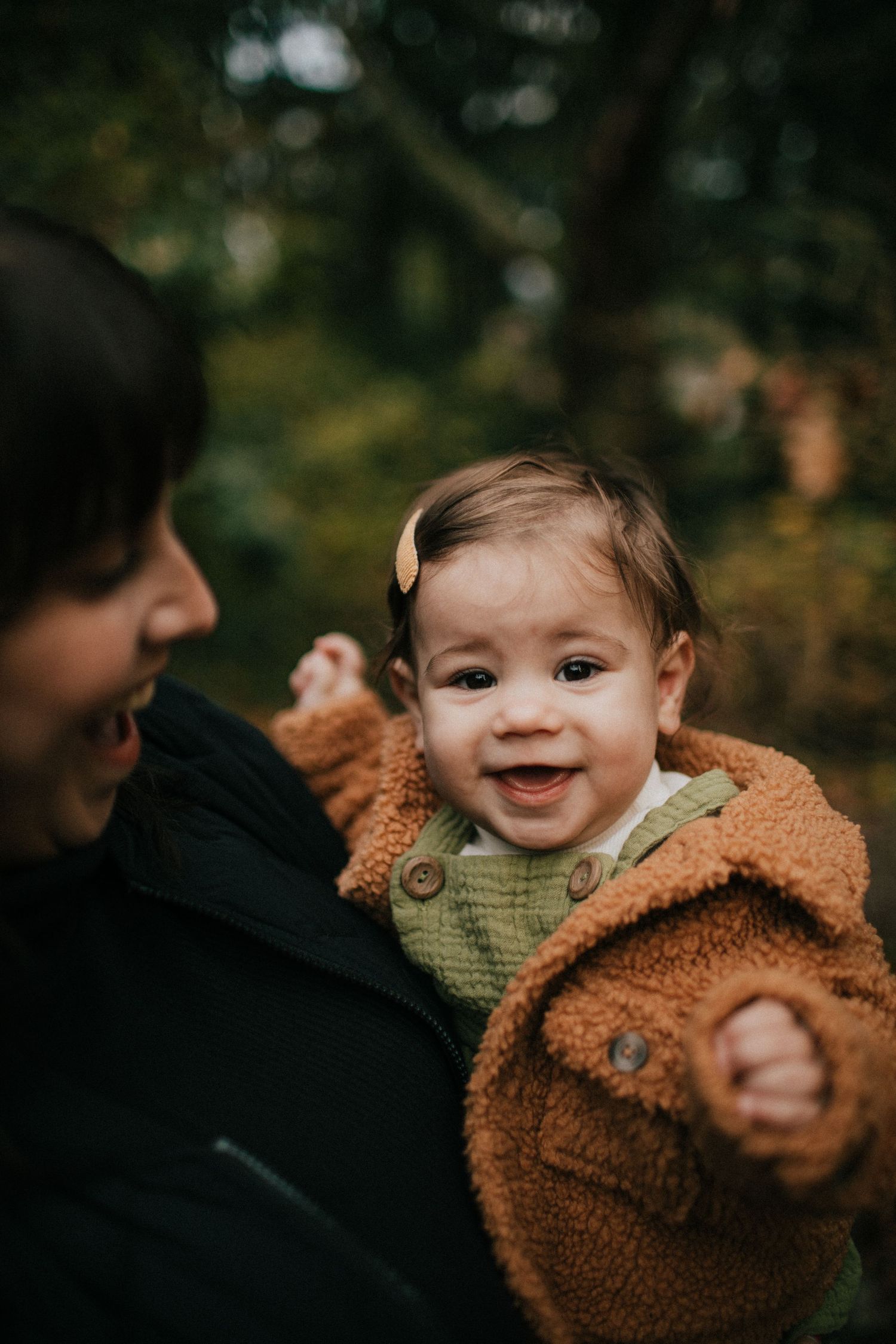 Image of a little girl laughing into the camera.