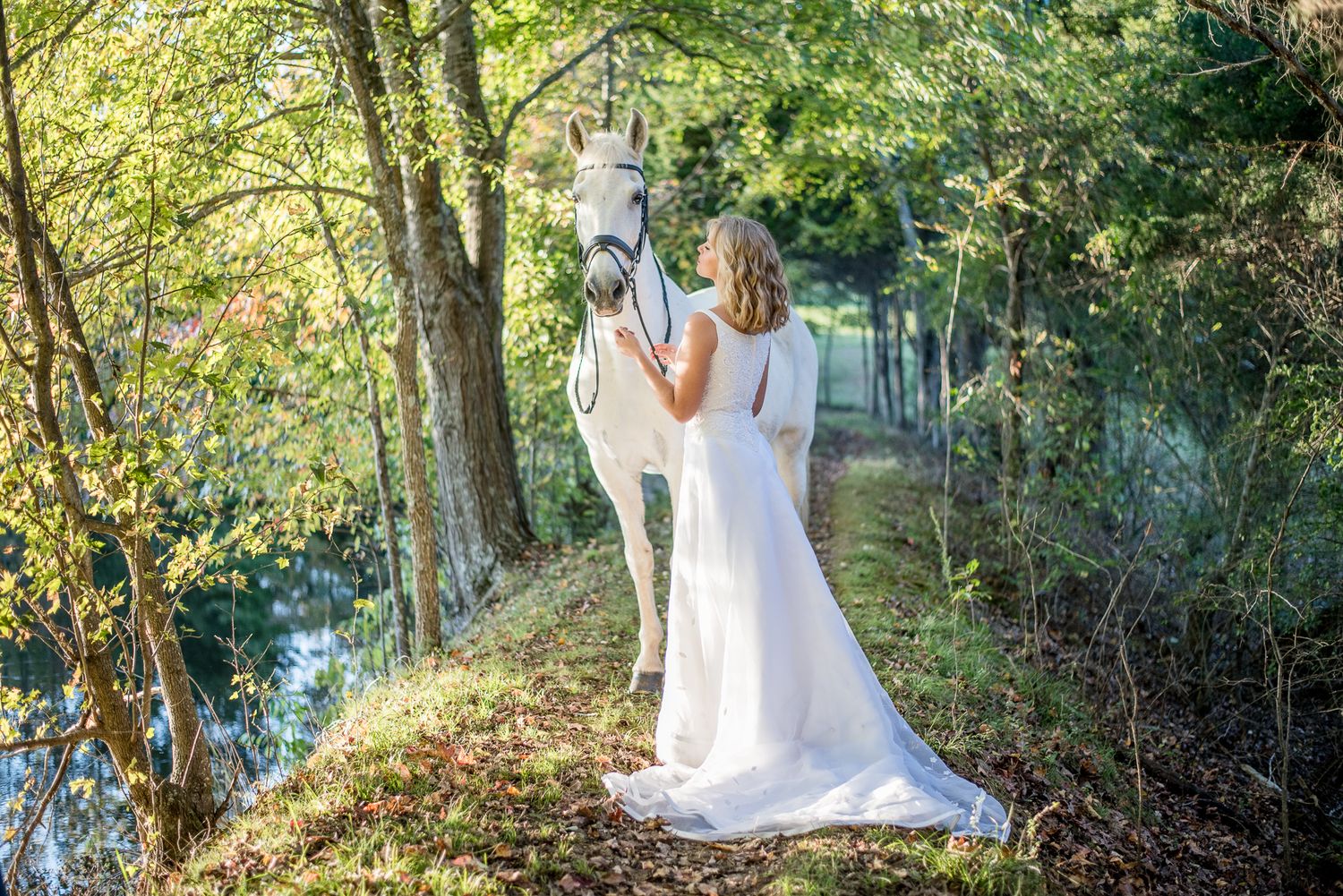Wedding photographer, Huntsville, alabama, bride, wedding dress, stables, bride with horse