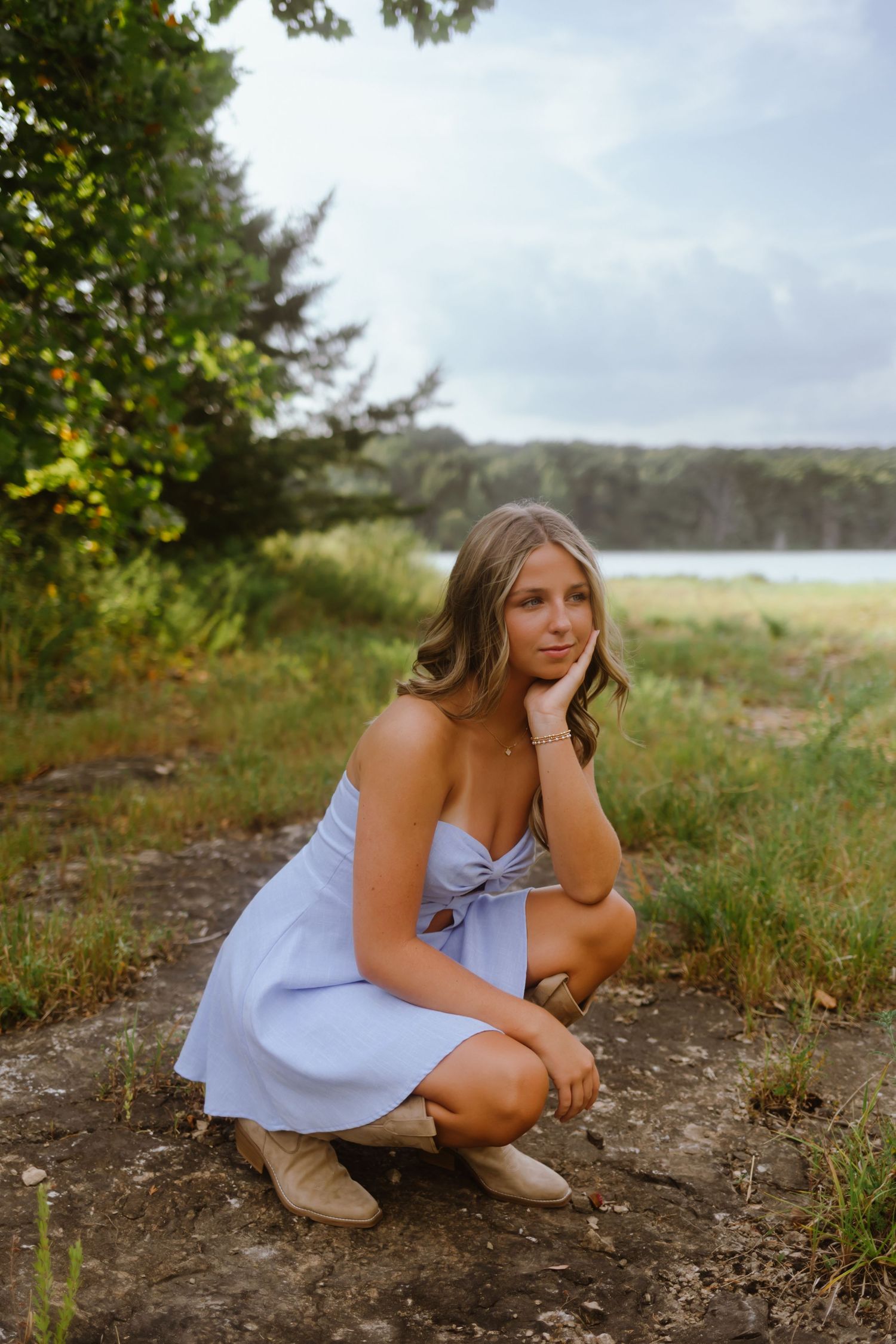 Four lifestyle portrait photos captured outdoors against a natural backdrop of grass and trees.