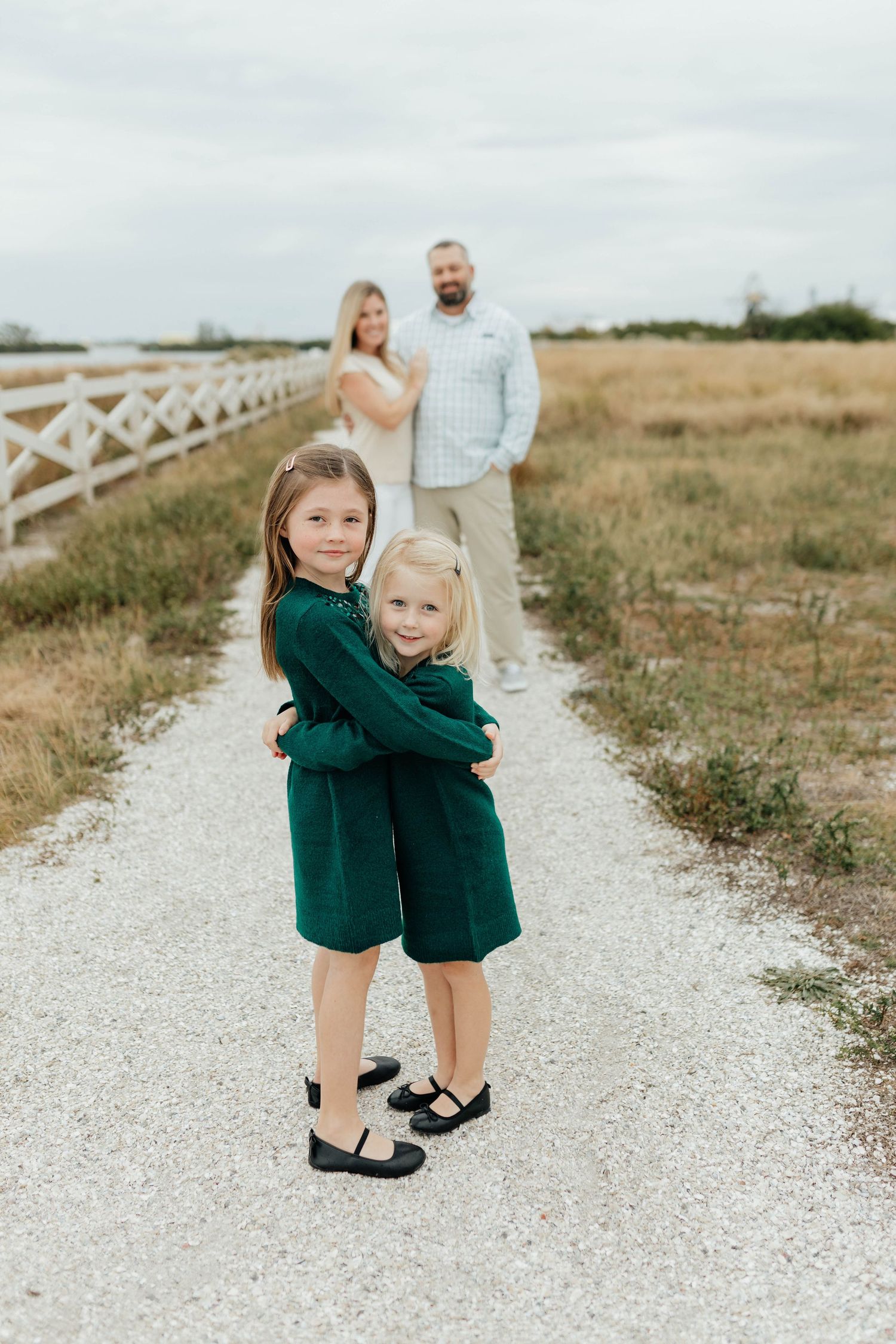 Child walking along a path during a candid family photography session captured by Breanna Watts Photography.