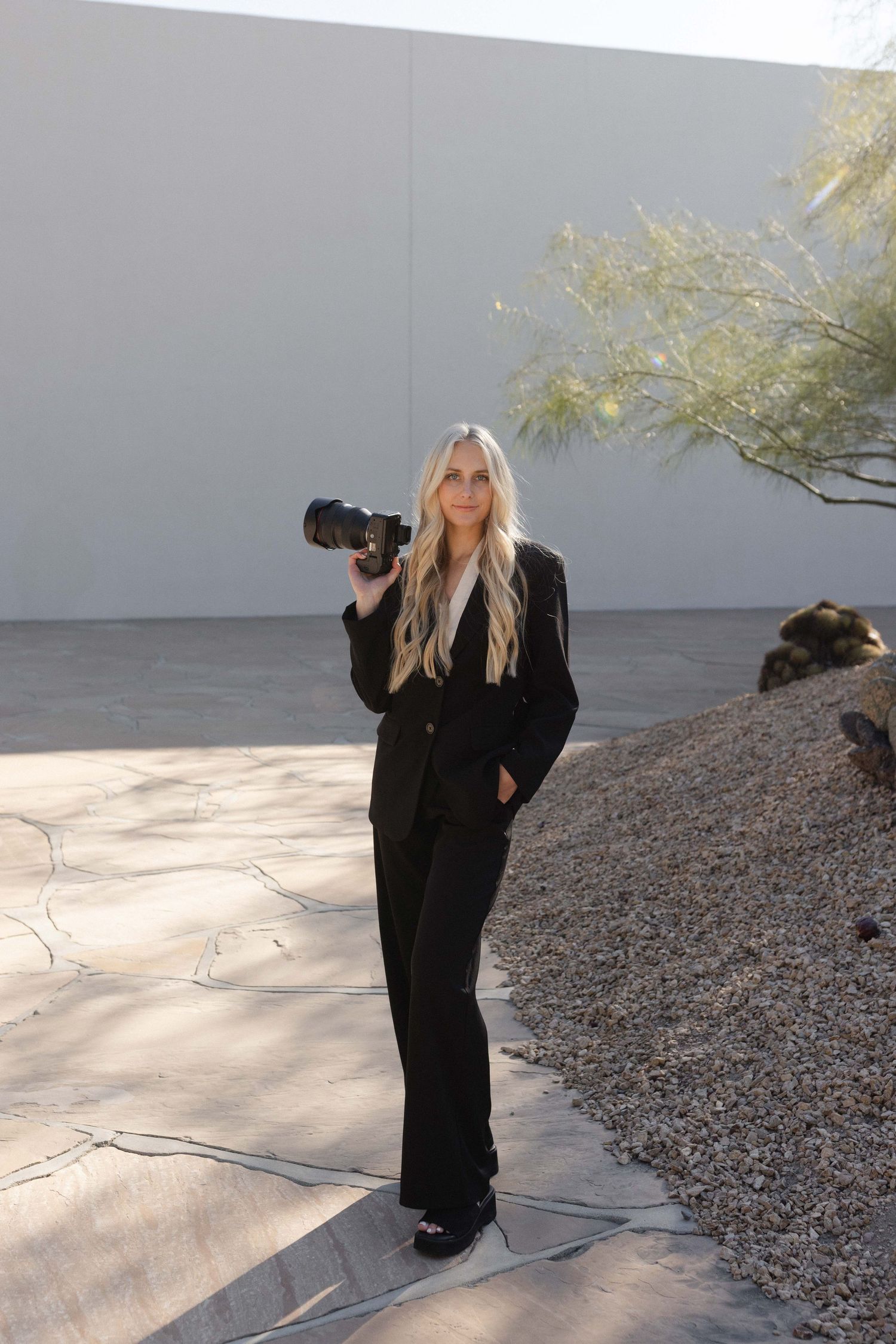 Fashion photography sequence with camera equipment in outdoor desert setting.