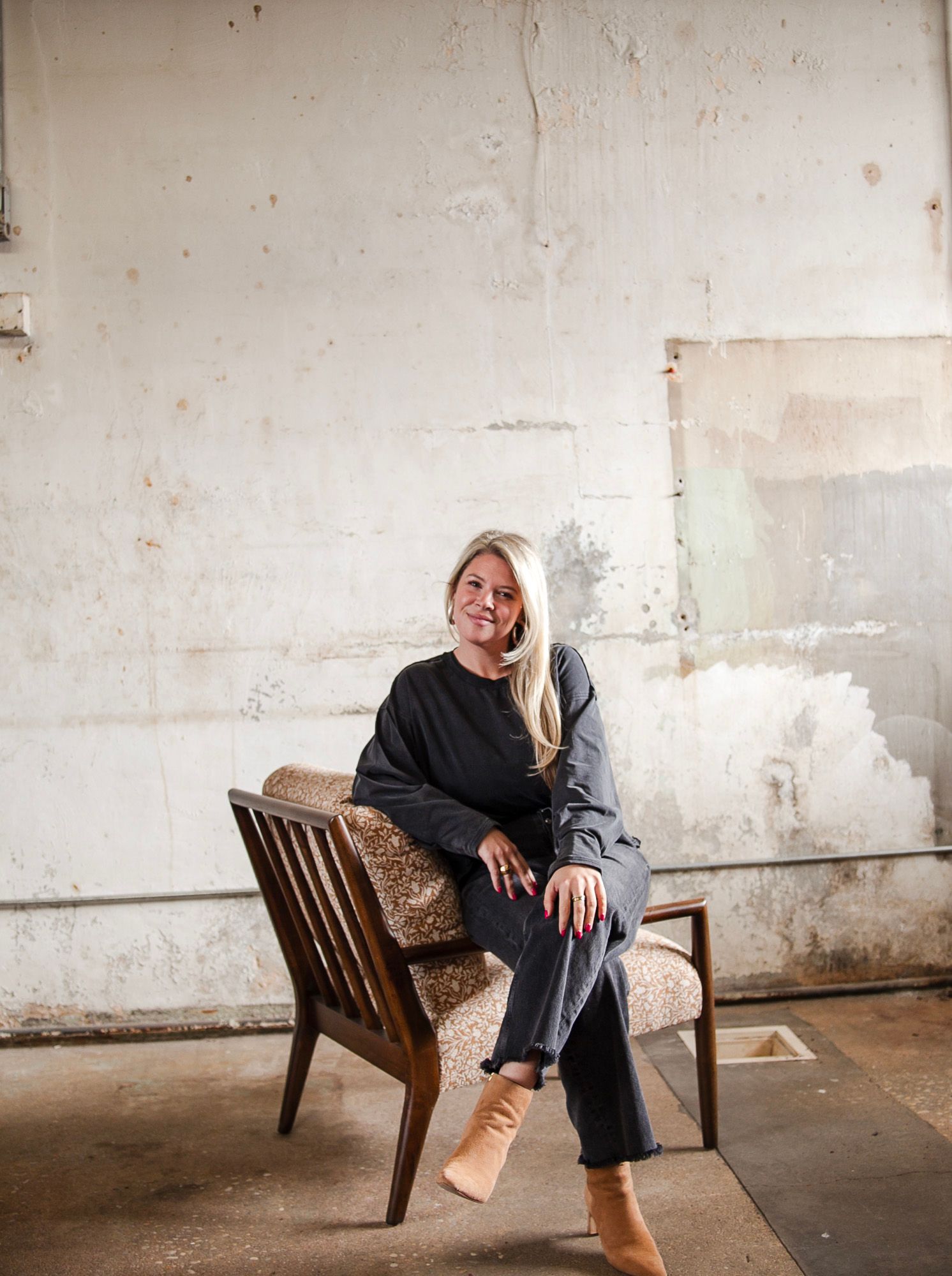 Personal branding photo session in charlotte NC with Lauren of Elle Luna Interior Design, casual lifestyle portrait in an industrial space.