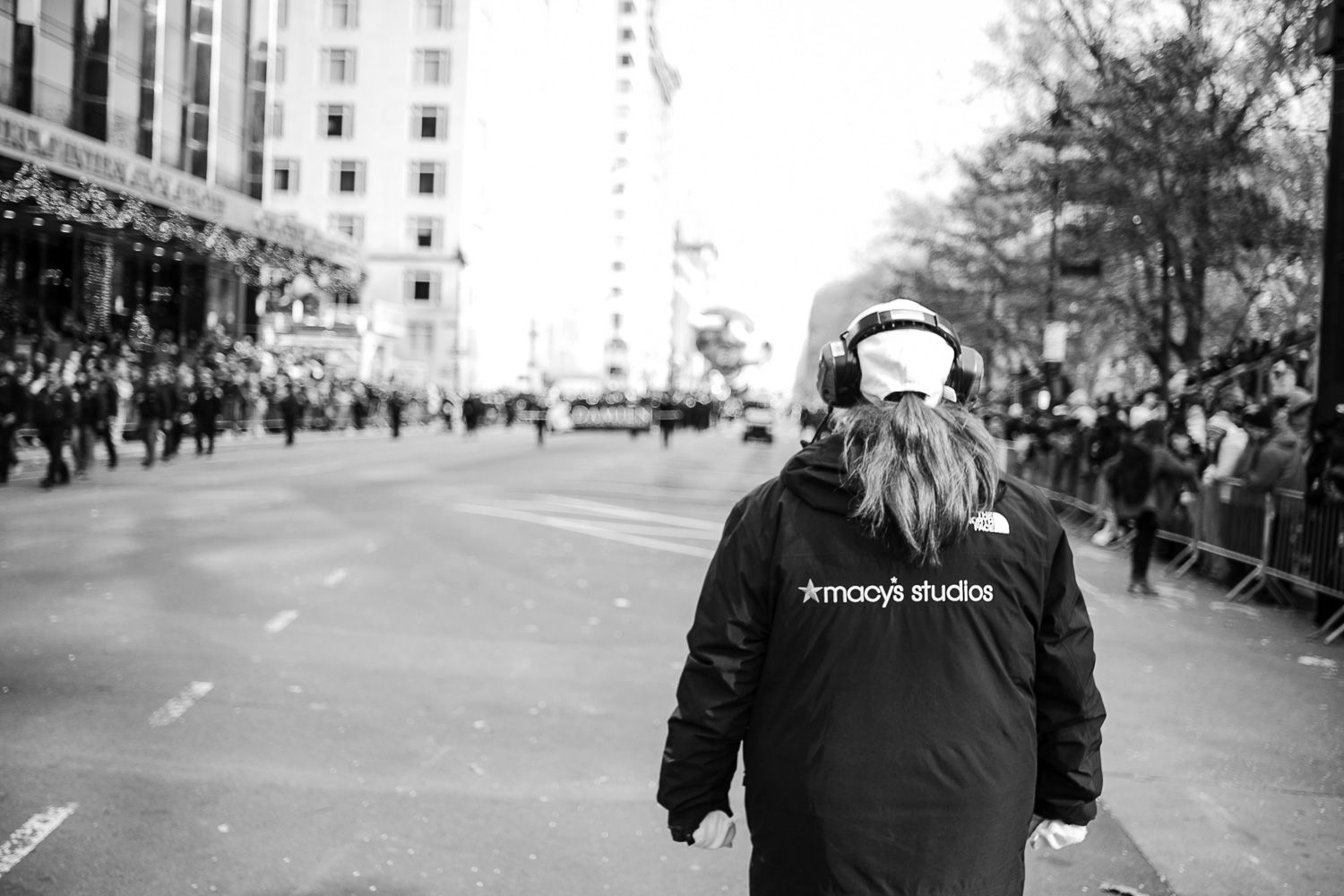 Sequence of black and white protest images showing crowds and police in riot gear on city streets.