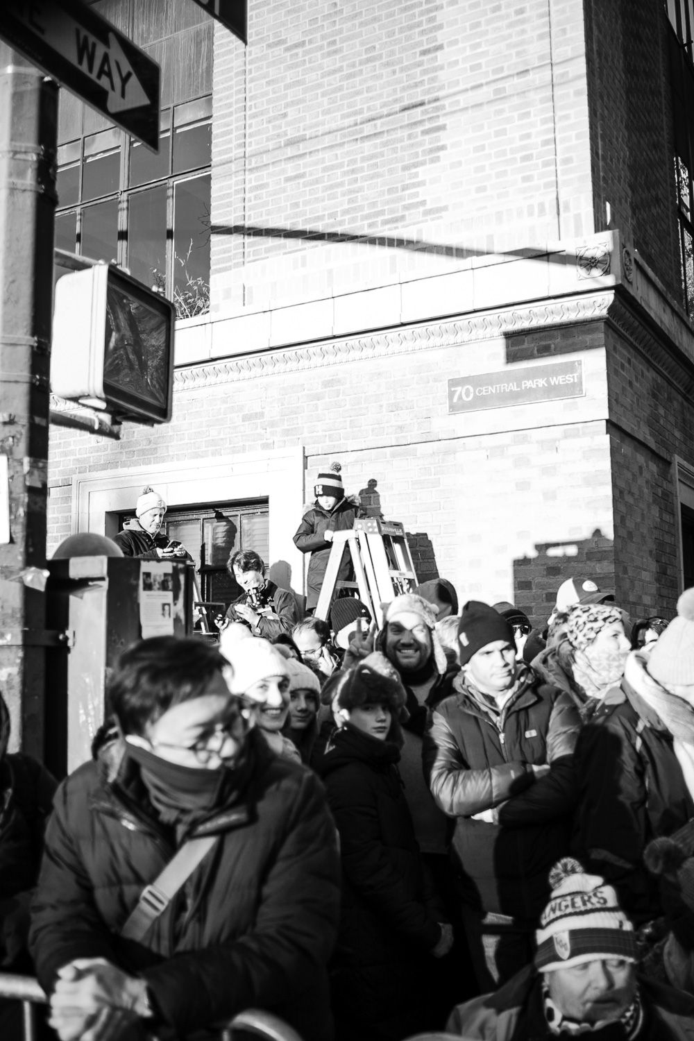 Children watching the Macy's thanksgiving parade with excitement in New York City.