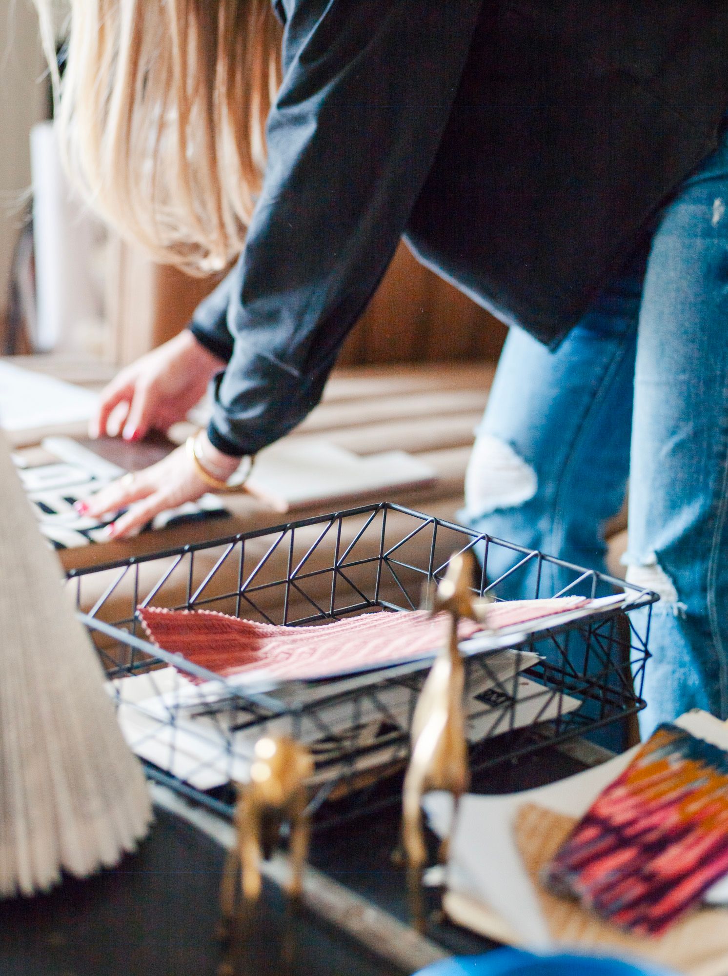 Personal branding photo session in Stanly County with Lauren of Elle Luna Interior Design, close-up detail of hands assembling decor.