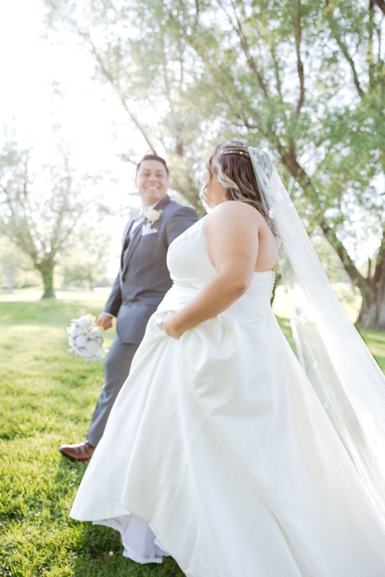Artistic wedding photography sequence showing romantic moments on a sunlit grassy hillside.