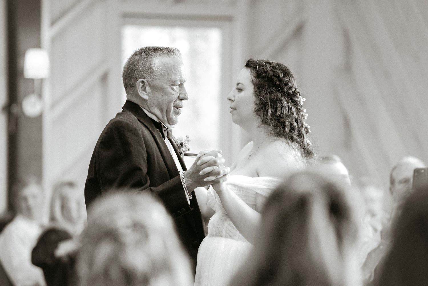 A black and white photo series showing couples dancing at a wedding reception.
