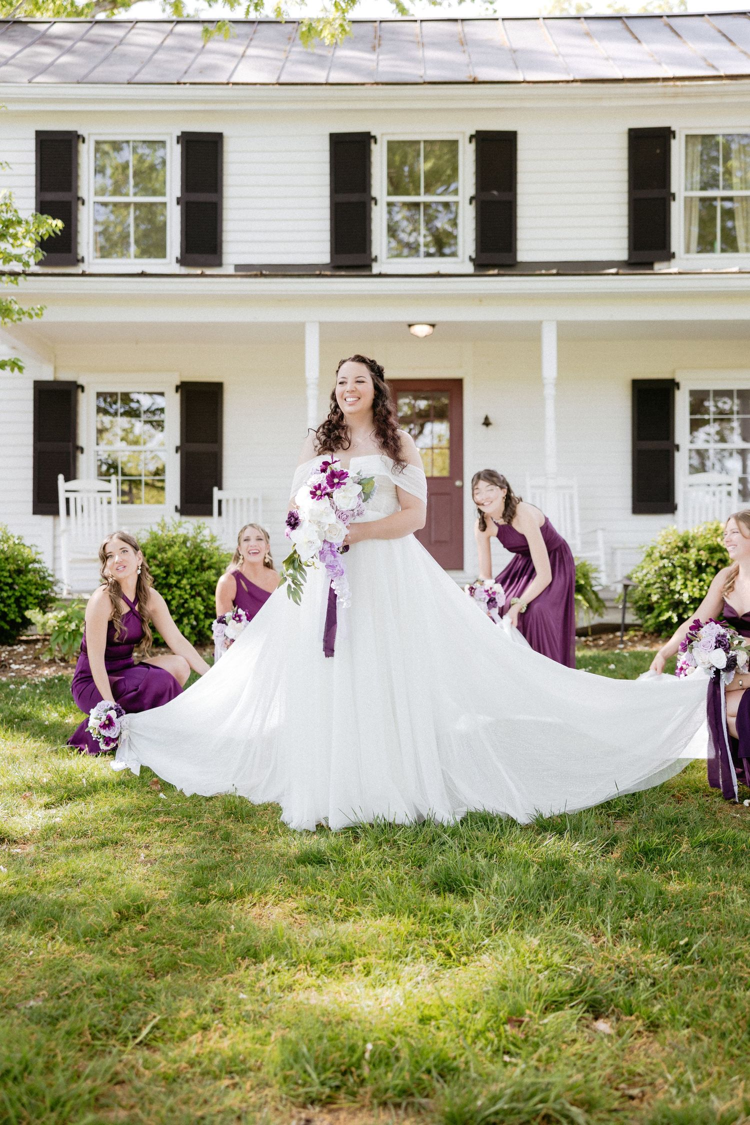A sequence of images showing a white wedding dress flowing on green grass in front of a white house with purple bridesmaids.
